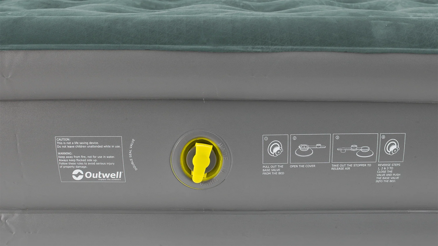 Outwell inflatable airbed with yellow valve and usage instructions for camping and outdoor adventures