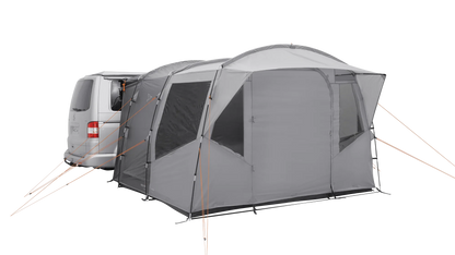 Gray motorhome awning attached to van, featuring mesh windows and orange guy lines for outdoor camping.