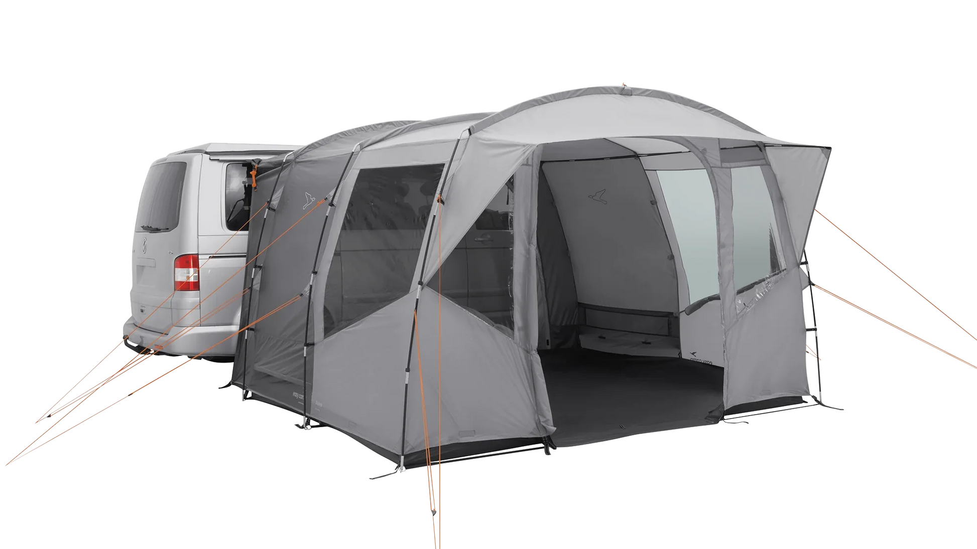 Gray motorhome awning with orange guy lines attached to van for outdoor camping setup
