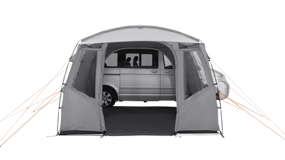Gray motorhome awning with orange guy lines, providing shelter for a van