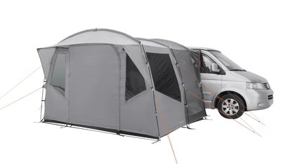 Gray motorhome awning attached to van, ideal for camping adventures and outdoor gear setups.