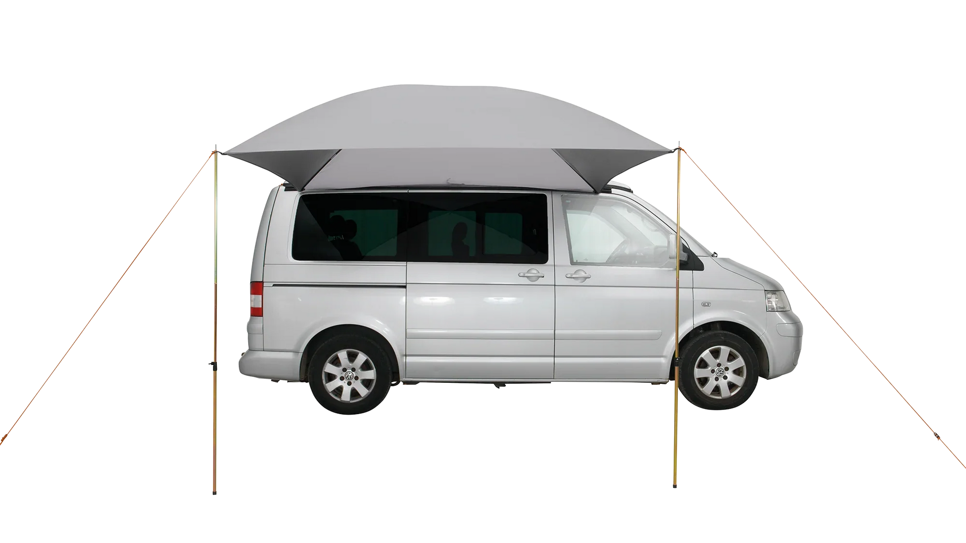 Motorhome awning attached to silver van for outdoor camping adventures