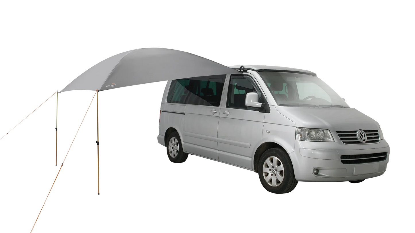 Gray motorhome awning attached to van for outdoor camping shade