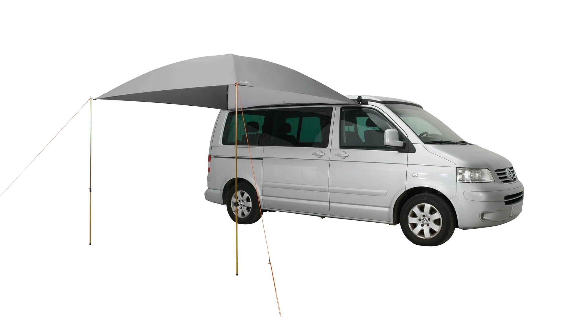 Gray motorhome awning attached to silver van for outdoor camping adventures