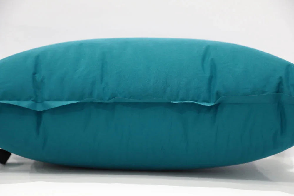 Teal camping pillow for outdoor adventures and comfortable sleeping gear