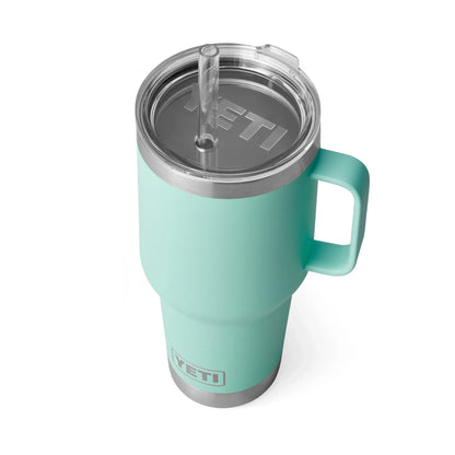 Mint green Yeti travel mug with handle and straw lid for outdoor adventures