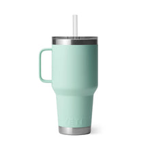 Mint green Yeti travel mug with handle and straw, ideal for outdoor adventures and camping trips.