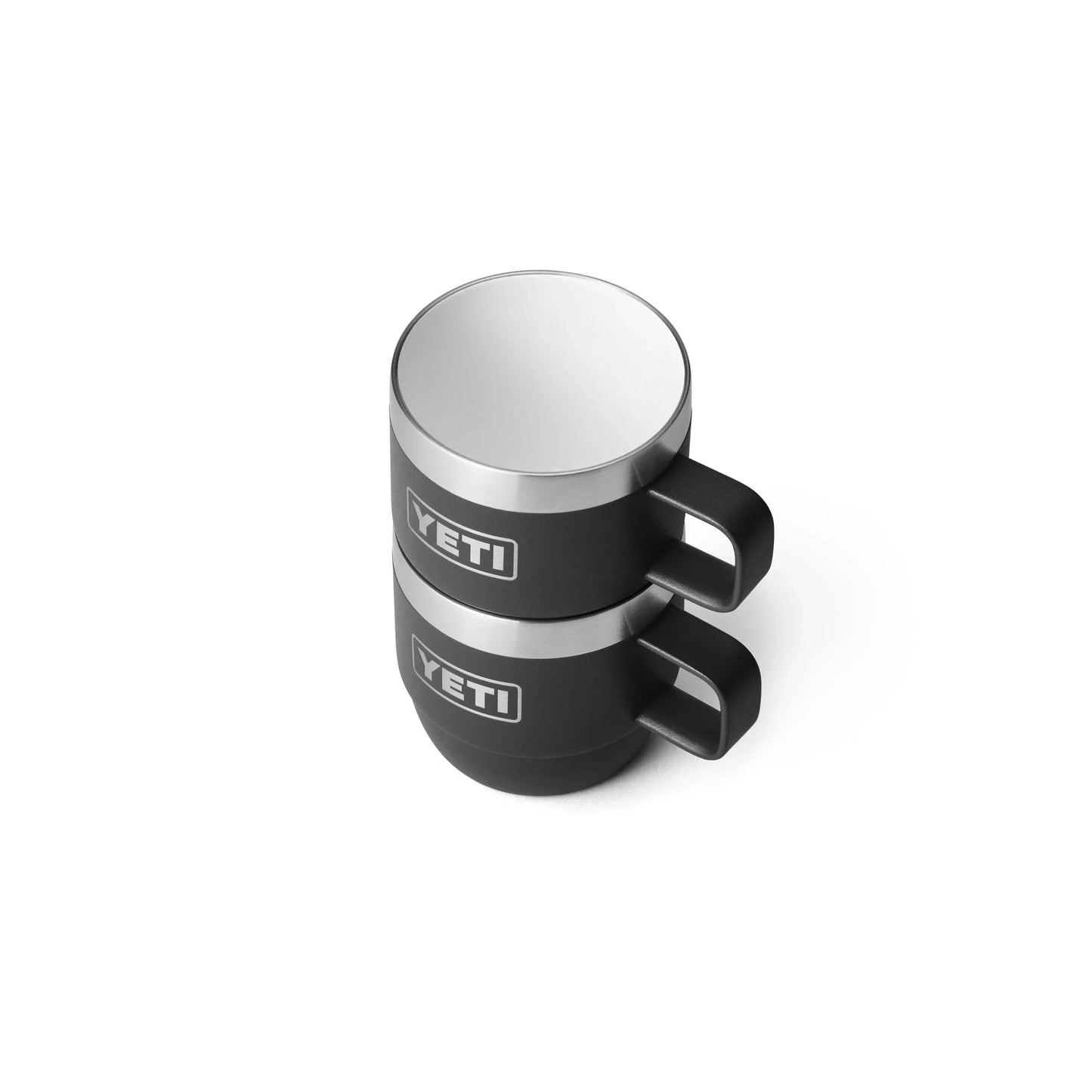 Stacked black YETI camping mugs with stainless steel rims, ideal for outdoor adventures and caravanning