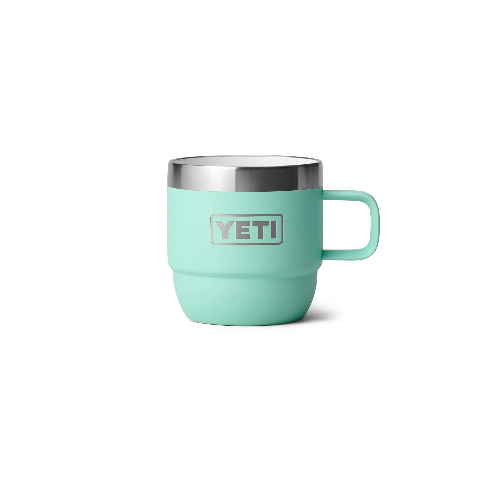 Mint green YETI insulated mug with stainless steel rim and handle for outdoor adventures