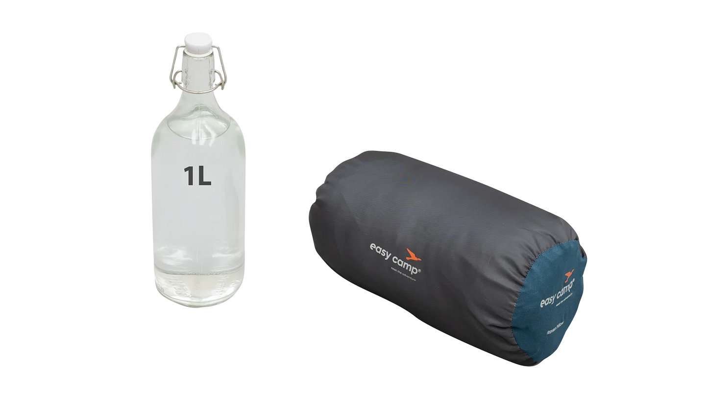 1L glass water bottle beside easy camp Raven Pillow for camping adventures