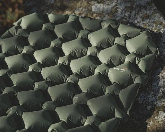 Olive green camping sleeping pad with hexagonal design, ideal for outdoor adventures and caravanning.