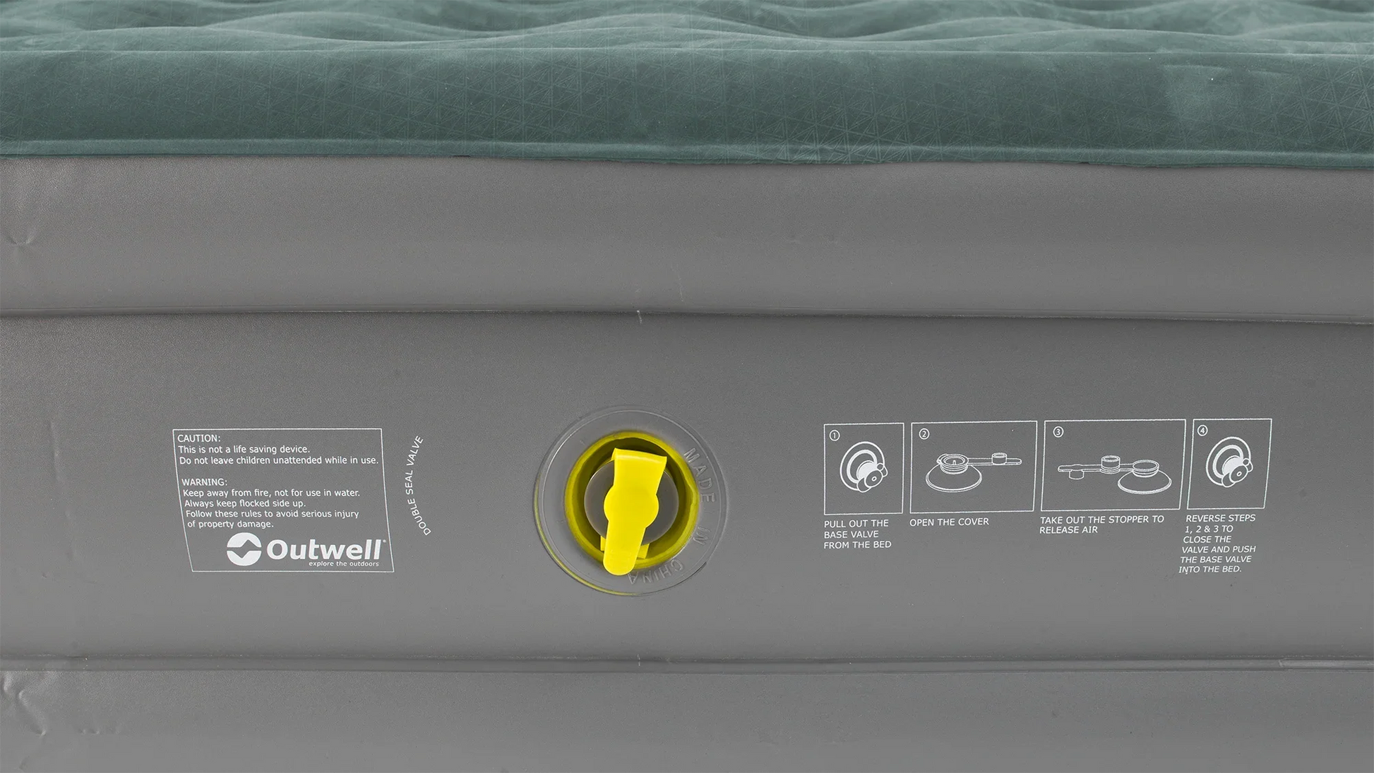 Outwell inflatable airbed with yellow valve and usage instructions for camping and outdoor adventures