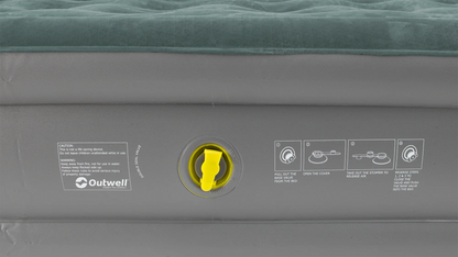 Outwell inflatable airbed with yellow valve and usage instructions for camping and outdoor adventures