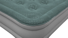 Teal quilted air mattress with geometric pattern, ideal for camping and outdoor sleeping gear