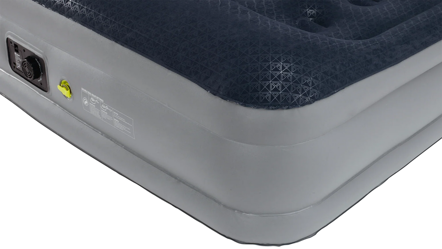 Inflatable camping air mattress with built-in pump and geometric patterned surface