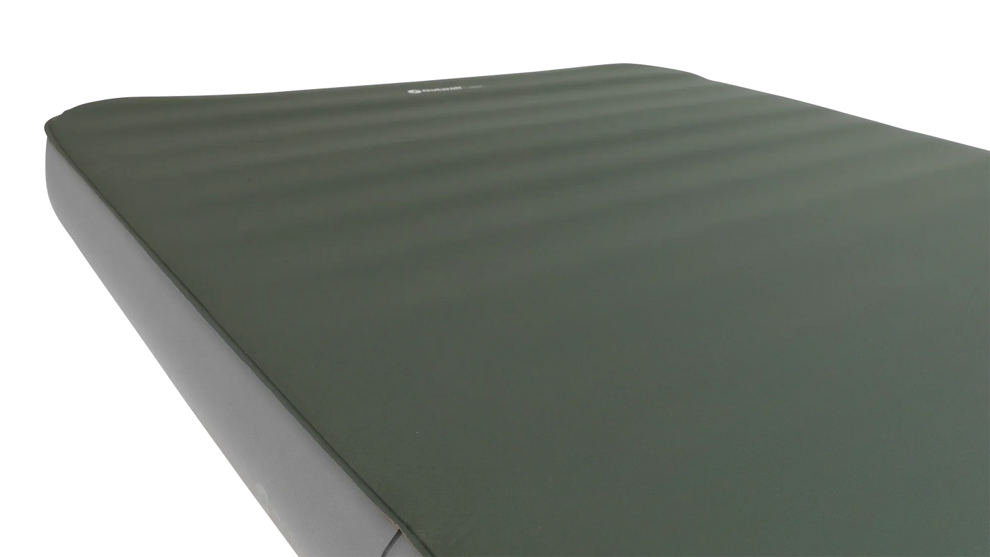 Green camping sleeping mat with ribbed texture for outdoor adventures