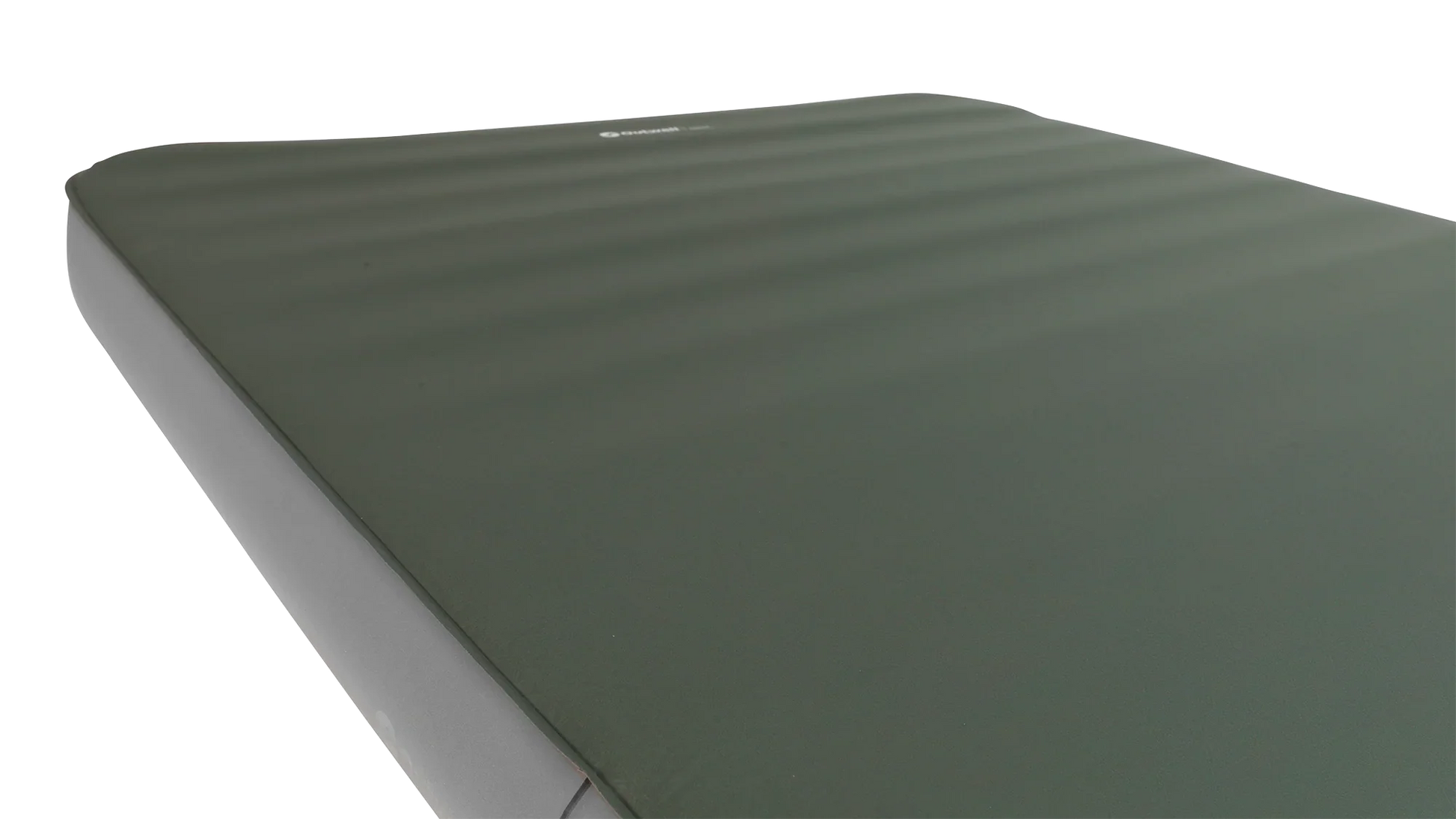 Green camping sleeping mat with ribbed texture for outdoor adventures