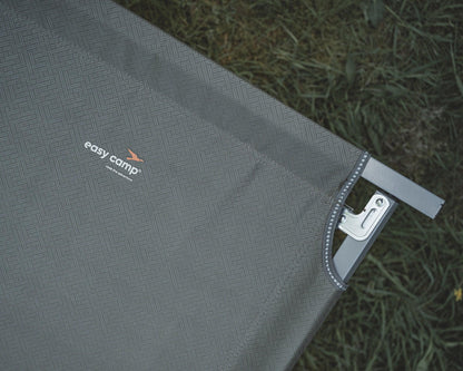 Easy Camp camping chair with textured fabric and metal frame on grass