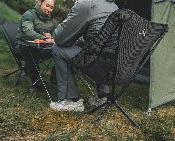 Portable camping chairs for outdoor adventures, perfect for relaxing near a tent with cozy gear.