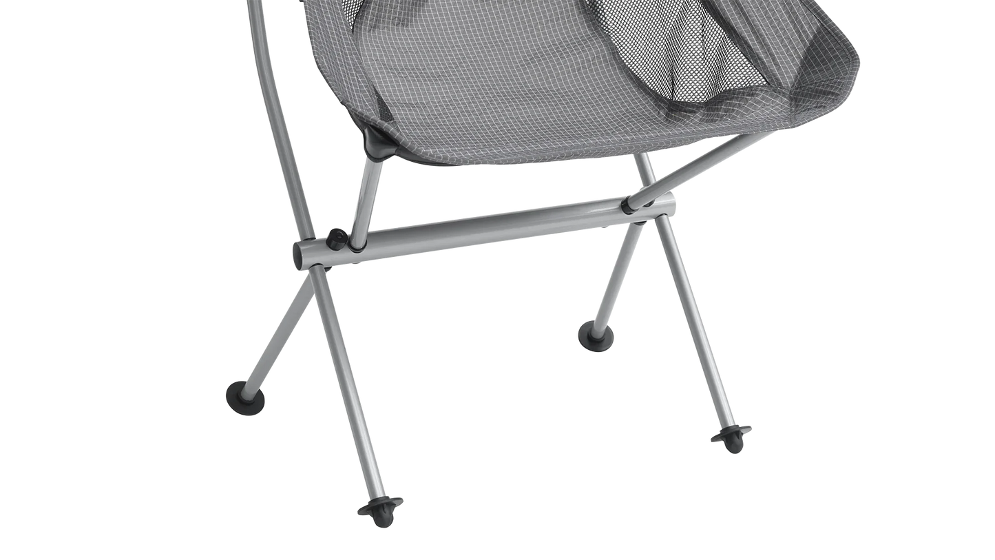Grey mesh camping chair with silver frame and black feet, ideal for outdoor adventures and caravanning trips.