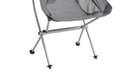 Grey mesh camping chair with silver frame and black feet, ideal for outdoor adventures and caravanning trips.