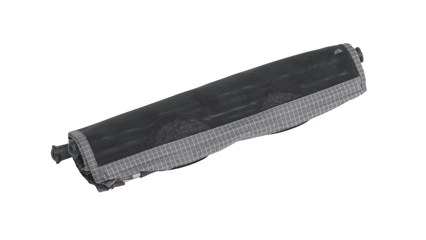 Compact rolled camping awning with gray grid trim, ideal for caravans and motorhomes