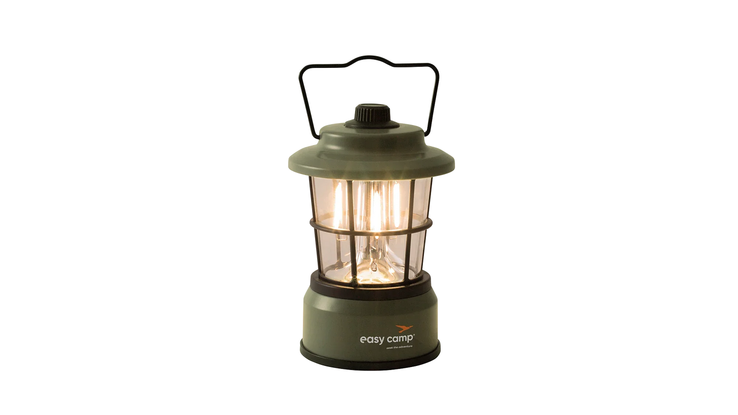 Green Easy Camp lantern with warm glow, ideal for camping and outdoor adventures.