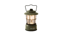 Green Easy Camp lantern with warm glow, ideal for camping and outdoor adventures.