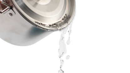 Stainless steel camping pot pouring water, ideal for outdoor cooking adventures