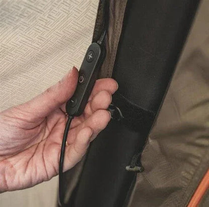 Hand adjusting control panel on camping gear with power buttons