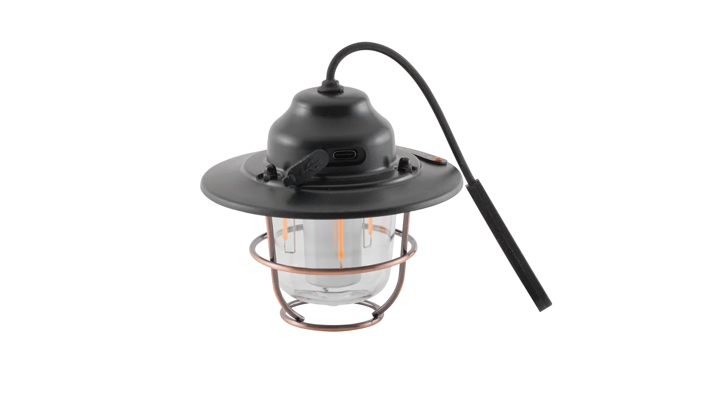 Portable camping lantern with copper cage, USB charging, and hanging hook for outdoor adventures