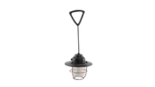 Portable camping lantern with copper cage, black handle, and LED light for outdoor adventures