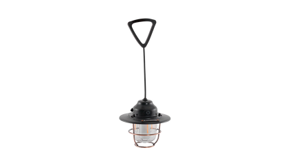 Portable camping lantern with copper cage, black handle, and LED light for outdoor adventures