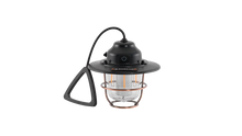 Portable camping lantern with copper cage and black handle for outdoor adventures