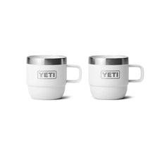 White YETI insulated mugs with handles, perfect for camping and outdoor adventures