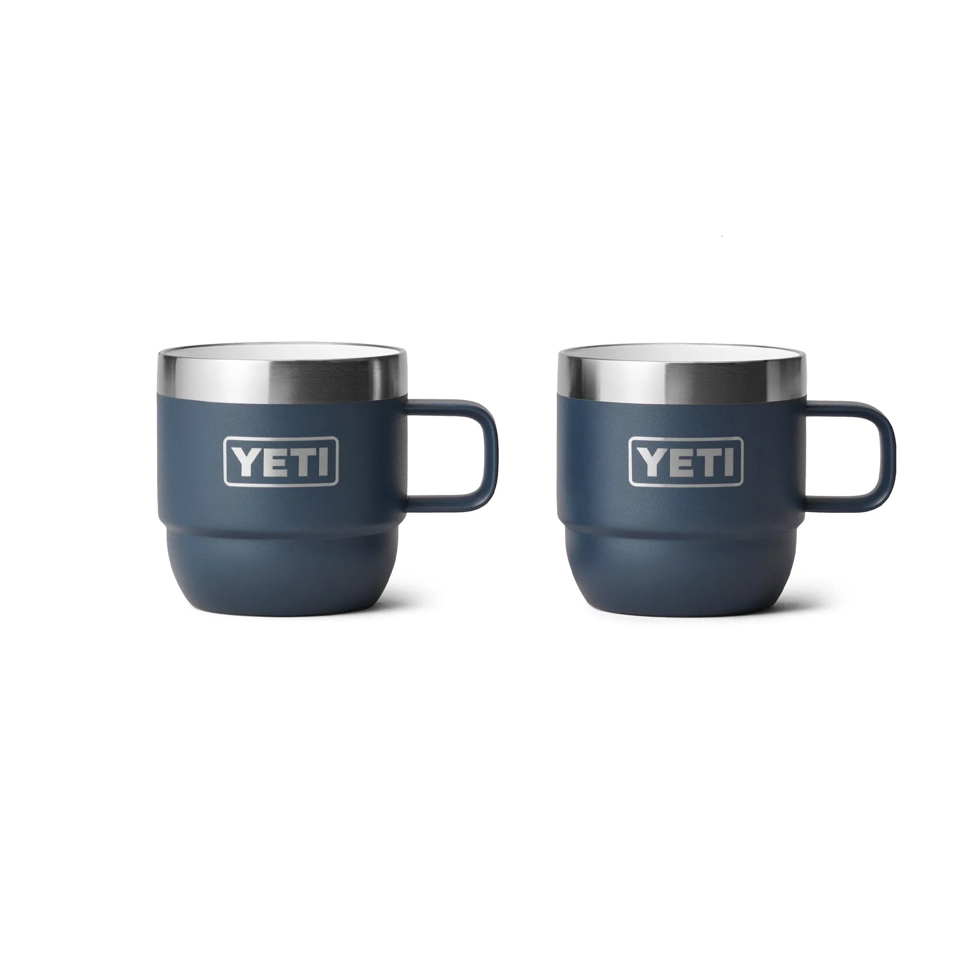 Two navy Yeti insulated mugs with handles, ideal for camping and outdoor adventures.