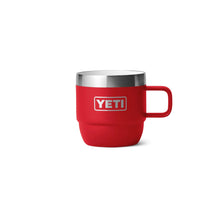 Red YETI insulated camp mug with handle, ideal for outdoor adventures and camping trips.