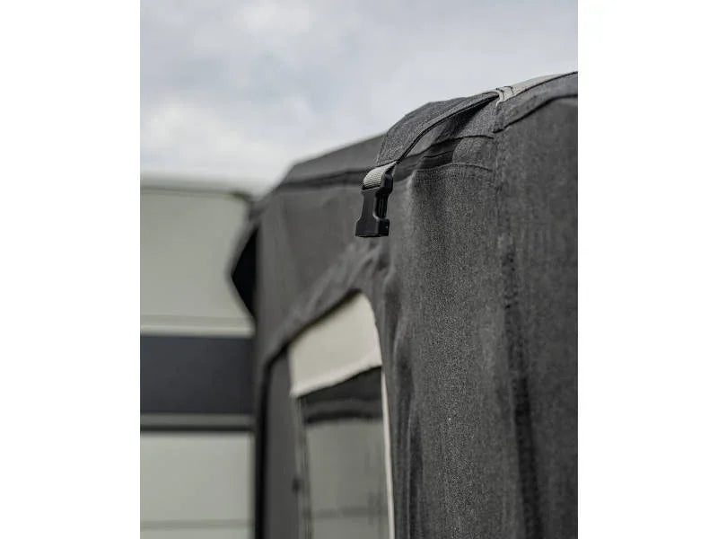 Caravan awning with secure strap and durable fabric for outdoor camping adventures