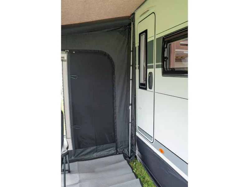 Motorhome awning with privacy door, ideal for camping and outdoor adventures