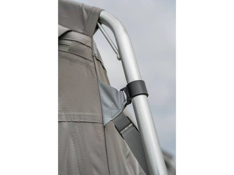 Close-up of durable camping chair with metal frame and fabric seat, ideal for outdoor adventures and caravanning trips.