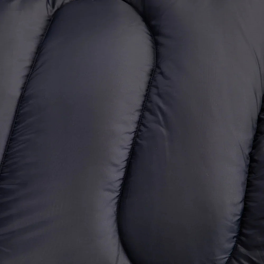 Close-up of dark gray insulated sleeping bag with stitched baffles for camping and outdoor adventures