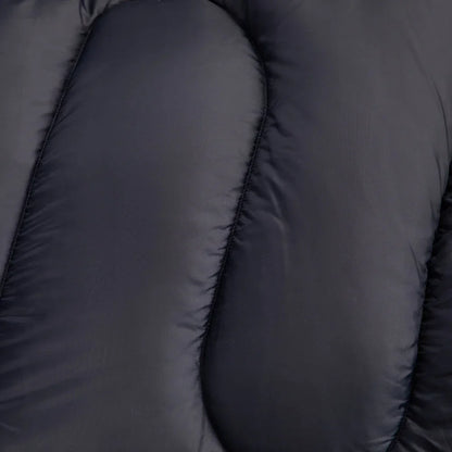 Close-up of dark gray insulated sleeping bag with stitched baffles for camping and outdoor adventures