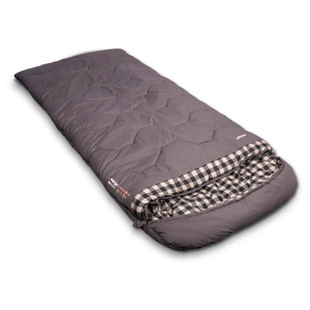 Grey quilted camping sleeping bag with checkered interior, ideal for outdoor adventures and camping trips.