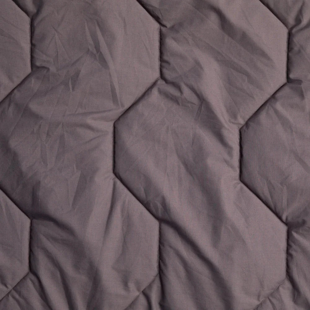 Grey hexagonal quilted sleeping bag liner for camping and outdoor adventures