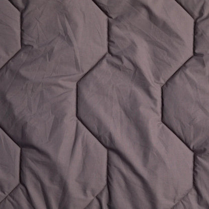 Grey hexagonal quilted sleeping bag liner for camping and outdoor adventures