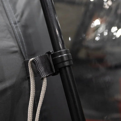 Black tent pole with adjustable strap and rope for camping gear setup