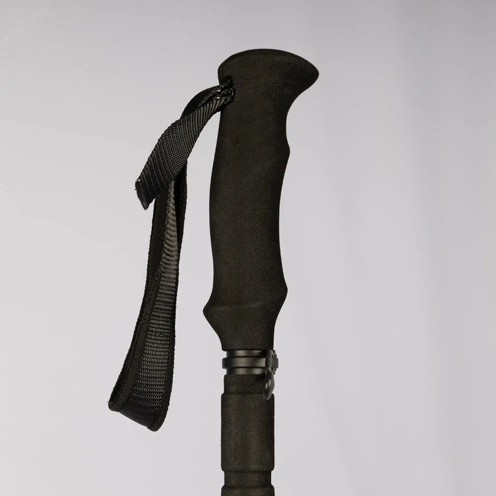 Black ergonomic hiking pole grip with wrist strap for outdoor adventures and trekking