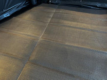 Foldable camping mat with textured surface for outdoor adventures and comfort