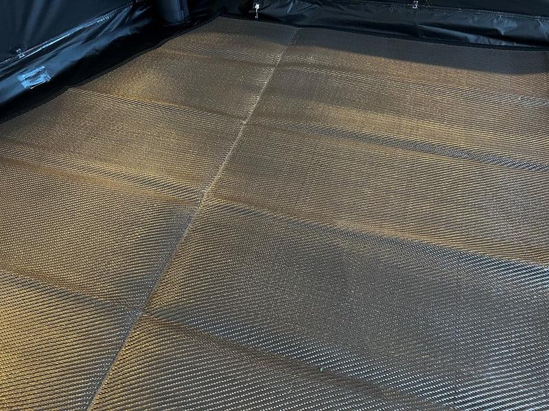 Foldable camping mat with textured surface for outdoor adventures and comfort