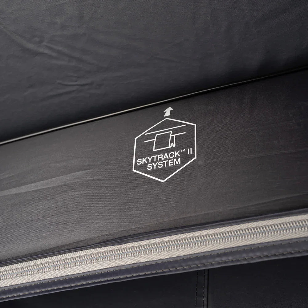 SkyTrack II System logo on black outdoor gear fabric with zipper detail